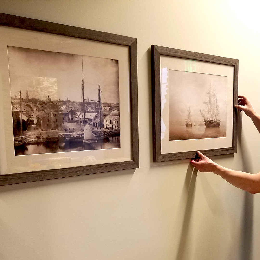 image of art being hung on a wall